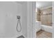 Functional laundry area adjacent to a tiled bathroom with essential hookups and storage at 2716 Salt Lake St, North Las Vegas, NV 89030