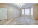 Large bedroom featuring stone floors and a decorative chandelier at 283 Auster Park Ave, Las Vegas, NV 89148
