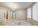 Bedroom featuring stone floors, and a decorative chandelier at 283 Auster Park Ave, Las Vegas, NV 89148