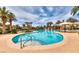 Resort-style pool with umbrellas, palm trees, and ample space for relaxation, creating a perfect oasis at 283 Auster Park Ave, Las Vegas, NV 89148