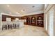 Spacious kitchen featuring custom shelving, granite counters, and access to the patio at 283 Auster Park Ave, Las Vegas, NV 89148