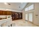 Bright kitchen featuring custom shelving and access to the patio at 283 Auster Park Ave, Las Vegas, NV 89148
