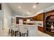 Well-equipped kitchen features island seating and custom cabinetry at 283 Auster Park Ave, Las Vegas, NV 89148