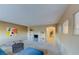 Carpeted loft area featuring multiple windows, and modern decor at 283 Auster Park Ave, Las Vegas, NV 89148