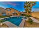 Inviting backyard featuring a sparkling pool, spa, and covered patio, ideal for entertaining at 283 Auster Park Ave, Las Vegas, NV 89148