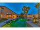 Backyard pool area with underwater lighting, providing a serene nighttime ambiance at 283 Auster Park Ave, Las Vegas, NV 89148