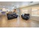 Living room featuring comfortable seating, a view of the kitchen, and large windows for ample natural light at 284 Pointe Ranier Ave, Henderson, NV 89012