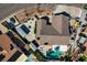 Expansive aerial view of the property showcasing the backyard pool and patio area, set within a landscaped yard at 3181 Shadow Bluff Ave, Las Vegas, NV 89120