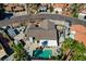 Aerial view of home with mature landscaping, a pool and patio area, and spacious driveway at 3181 Shadow Bluff Ave, Las Vegas, NV 89120