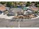 This aerial shows a well-maintained yard with a three car garage and driveway at 3181 Shadow Bluff Ave, Las Vegas, NV 89120