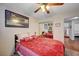 Comfortable bedroom featuring hardwood floors, mirrored closet, and access to the hall at 3181 Shadow Bluff Ave, Las Vegas, NV 89120