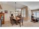 Formal dining area with a chandelier and plantation shutters at 3181 Shadow Bluff Ave, Las Vegas, NV 89120