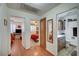 Hallway with hardwood floors connecting to bedrooms and a bathroom at 3181 Shadow Bluff Ave, Las Vegas, NV 89120