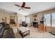 Cozy living room is complete with a fireplace and an adjoining dining area at 3181 Shadow Bluff Ave, Las Vegas, NV 89120