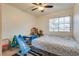 Bedroom with toys, bed, ceiling fan and window with natural light at 3491 Bankside Dr, Las Vegas, NV 89129
