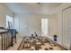 A bedroom with a large area rug, and a view into the en-suite bathroom at 3491 Bankside Dr, Las Vegas, NV 89129