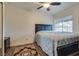 Bedroom with a queen bed, dresser, ceiling fan and decorative area rug at 3491 Bankside Dr, Las Vegas, NV 89129
