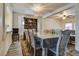 Formal dining room with large table and chairs, elegant lighting, and hardwood floors at 3491 Bankside Dr, Las Vegas, NV 89129