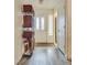 Inviting entryway featuring stylish gray flooring and a practical shelving unit for organized storage at 3491 Bankside Dr, Las Vegas, NV 89129