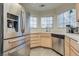 Bright kitchen featuring a stainless steel refrigerator and modern appliances at 3491 Bankside Dr, Las Vegas, NV 89129