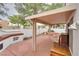 Inviting outdoor patio featuring a built-in grill, offering an ideal space for dining and entertaining at 3491 Bankside Dr, Las Vegas, NV 89129