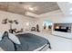Modern bedroom featuring a concrete ceiling, sleek furniture, and an adjoining office space at 360 E Desert Inn Rd # 604, Las Vegas, NV 89109
