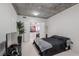 Modern bedroom with walk-in closet, concrete ceiling, and neutral carpet at 360 E Desert Inn Rd # 604, Las Vegas, NV 89109