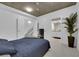 Modern bedroom with a staircase, tile floors, and neutral color palette at 360 E Desert Inn Rd # 604, Las Vegas, NV 89109