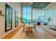 Dining space with mirrors, modern furnishings and striking views through large windows at 360 E Desert Inn Rd # 604, Las Vegas, NV 89109