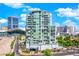 Modern high-rise condo building with blue sky views and lush landscaping at 360 E Desert Inn Rd # 604, Las Vegas, NV 89109
