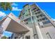 Upscale condo building showcasing modern architecture and meticulous landscaping at 360 E Desert Inn Rd # 604, Las Vegas, NV 89109