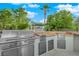 Outdoor kitchen with stainless steel grill and countertop space, surrounded by green trees at 360 E Desert Inn Rd # 604, Las Vegas, NV 89109