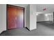 Hallway features patterned carpet, dark wood door and neutral paint, creating a welcoming entrance at 360 E Desert Inn Rd # 604, Las Vegas, NV 89109