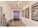 Modern hallway featuring sports memorabilia, artwork, and a bench at 360 E Desert Inn Rd # 604, Las Vegas, NV 89109