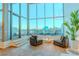 Comfortable lounge area with chairs and amazing cityscape views through bright, open windows at 360 E Desert Inn Rd # 604, Las Vegas, NV 89109
