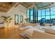 Open-concept living space with hardwood floors, modern decor, and stunning city views at 360 E Desert Inn Rd # 604, Las Vegas, NV 89109
