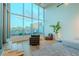 Cozy sitting area with panoramic city views through expansive floor-to-ceiling windows at 360 E Desert Inn Rd # 604, Las Vegas, NV 89109