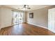 Bright bedroom featuring wood floors and a balcony door at 4045 Abernethy Forest Pl, Las Vegas, NV 89141