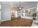 Open living room with wood floors, decorative lighting, and railing overlooking another living space at 4045 Abernethy Forest Pl, Las Vegas, NV 89141