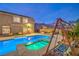 Beautifully designed backyard features a custom pool, spa, and lush seating area at 4045 Abernethy Forest Pl, Las Vegas, NV 89141