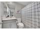 Cozy bathroom features a vanity sink, toilet, and shower-tub combo at 409 Wind Poppy St, Las Vegas, NV 89138