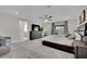 Spacious main bedroom featuring a ceiling fan, dresser, and comfortable seating area at 409 Wind Poppy St, Las Vegas, NV 89138