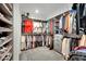 Well-organized walk-in closet with ample shelving and hanging space for clothing and shoes at 409 Wind Poppy St, Las Vegas, NV 89138