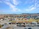 Expansive aerial view showcasing a residential neighborhood with mountain backdrop at 4368 Vornsand Dr, Las Vegas, NV 89115