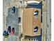 An aerial view of a multi-Gathering home with a brown roof, parking, and individual patios at 4368 Vornsand Dr, Las Vegas, NV 89115