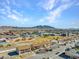 Wide aerial shot capturing a residential area with views of the distant mountains at 4368 Vornsand Dr, Las Vegas, NV 89115