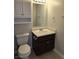 Cozy bathroom featuring a vanity with storage and a well-lit mirror at 4368 Vornsand Dr, Las Vegas, NV 89115