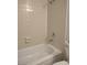 Bathtub with white tile surround and silver shower head and faucet fixture at 4368 Vornsand Dr, Las Vegas, NV 89115