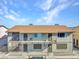 Apartment building featuring exterior stone accents, balconies, and secure gated access to the units at 4368 Vornsand Dr, Las Vegas, NV 89115