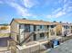 Two story apartment complex with exterior stone accents and gated access to the units at 4368 Vornsand Dr, Las Vegas, NV 89115